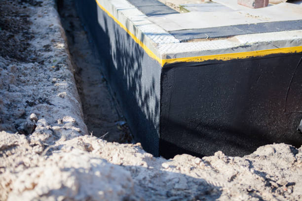 Professional Basement Waterproofing technician working in Carroll, OH